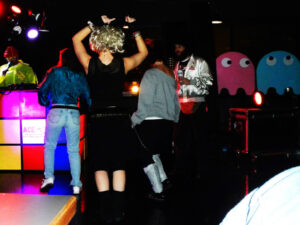 80s themed party with dancing people