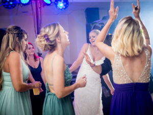 wedding with bride dancing around other women